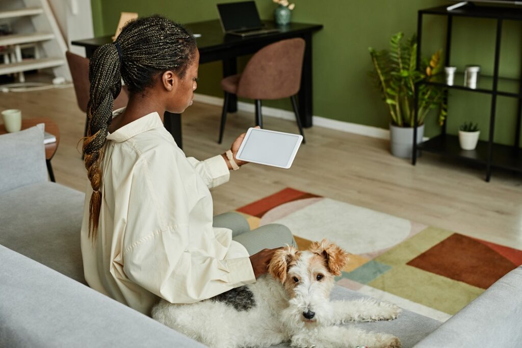 Black Woman in Modern Home with dog